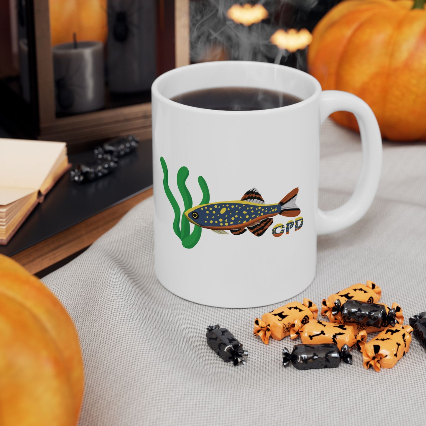 White Celestial Pearl Danio mug with fish and seaweed design filled with steaming coffee