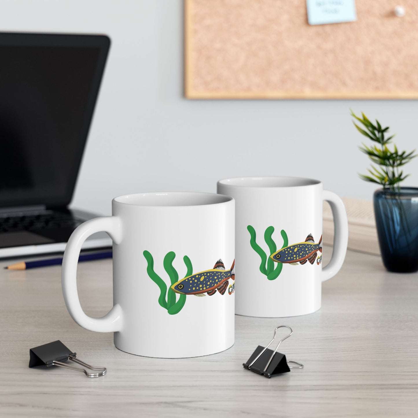 Celestial Pearl Danio mug with colorful fish and green seaweed design on white ceramic