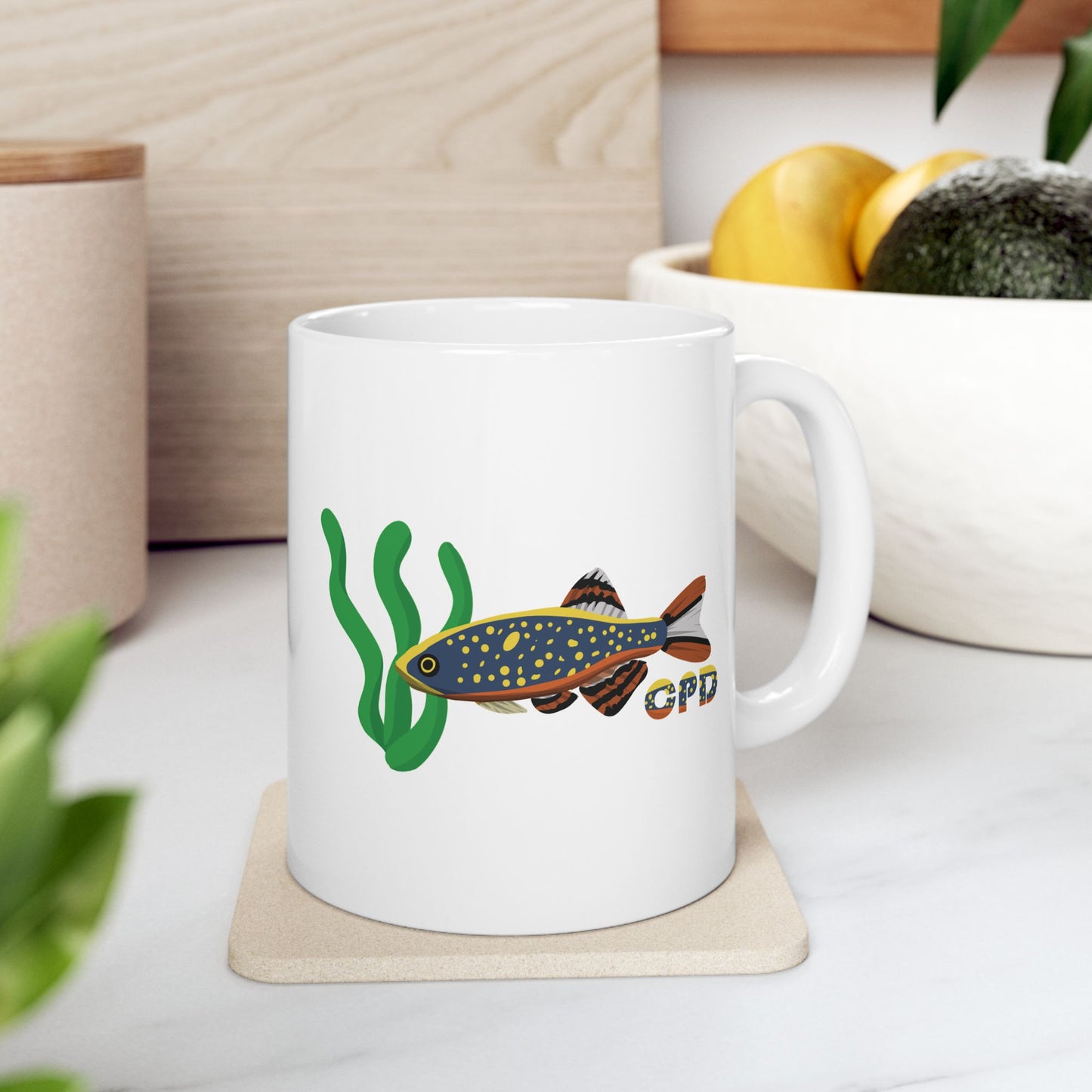 White mug featuring colorful Celestial Pearl Danio fish design with green aquatic plants