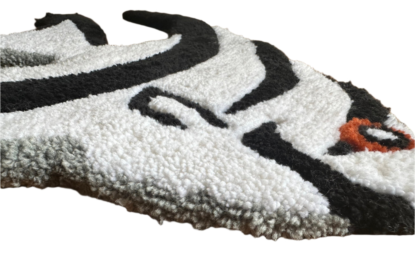 Scallywag's Fish Bowl handmade angelfish rug with textured white and black design and orange detail