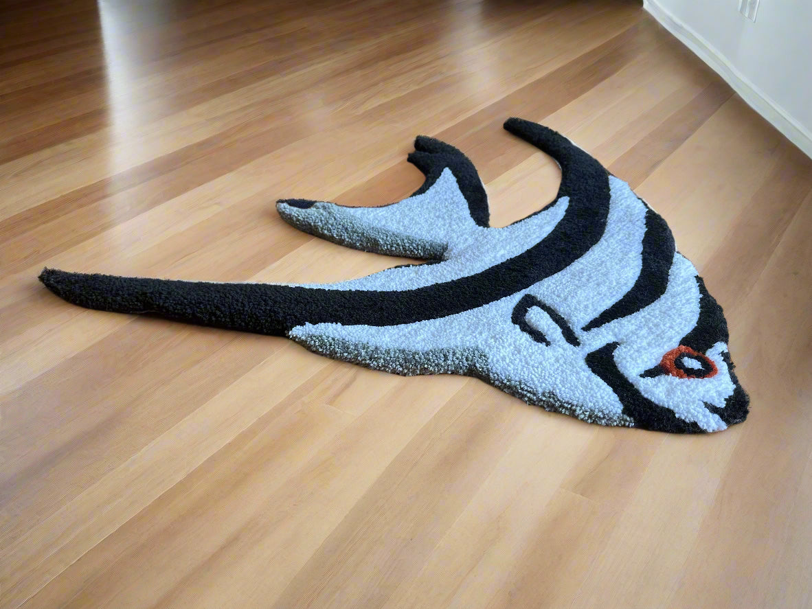 Handmade angelfish rug by Scallywag's Fish Bowl in black and white on wooden floor