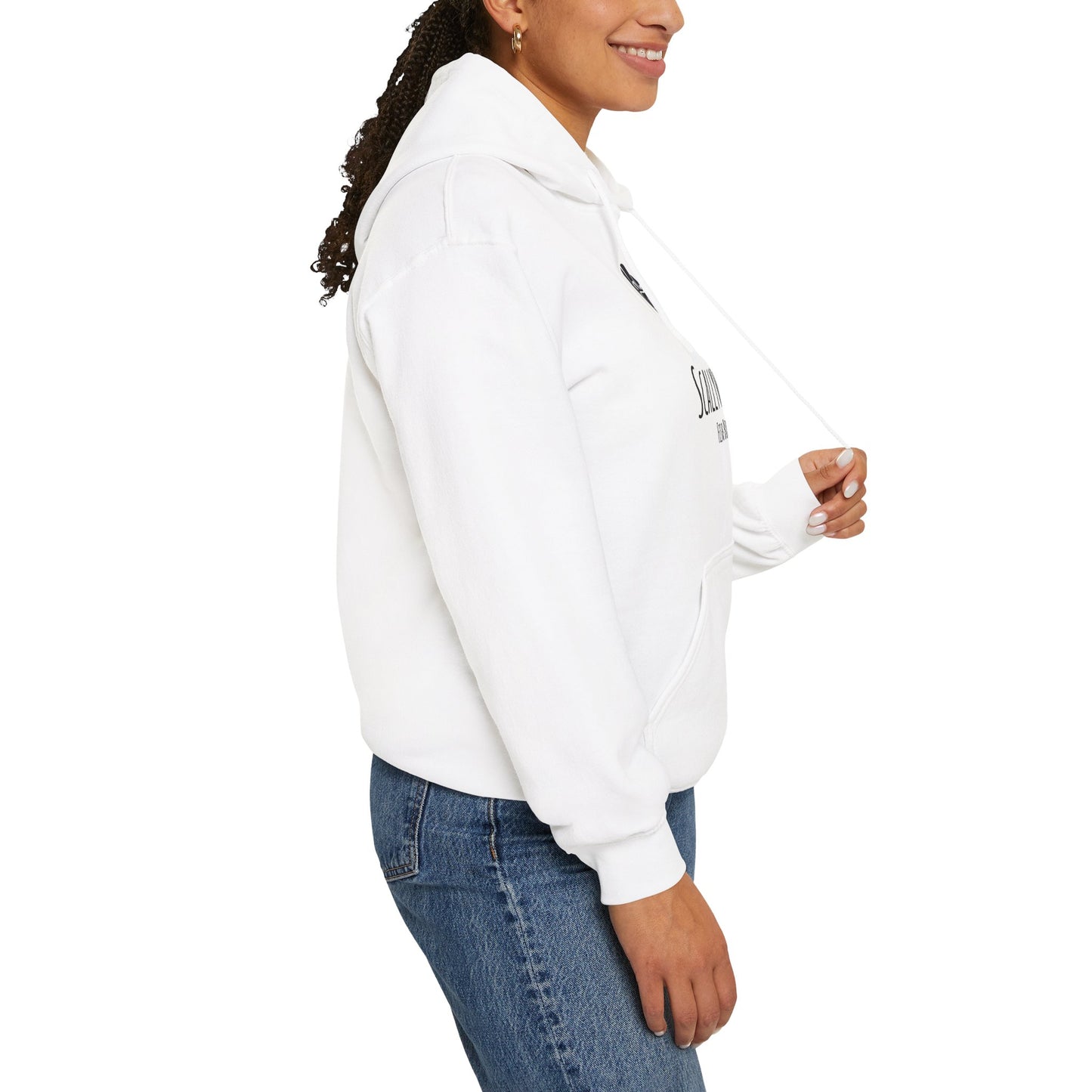 White Oscar fish hoodie from Printify worn by a smiling woman with blue jeans