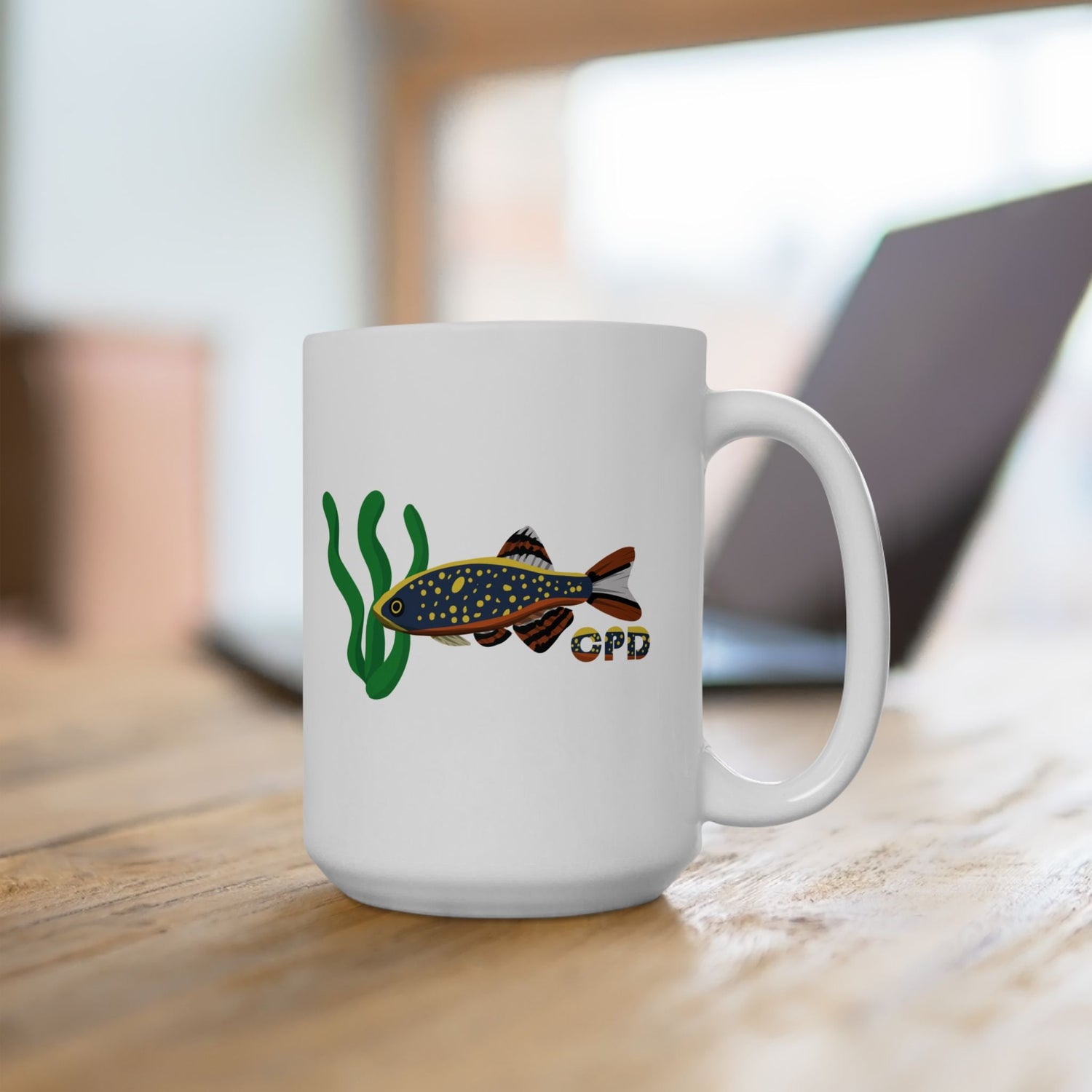 White ceramic mug with fish and seaweed design from fish clothing and merch collection