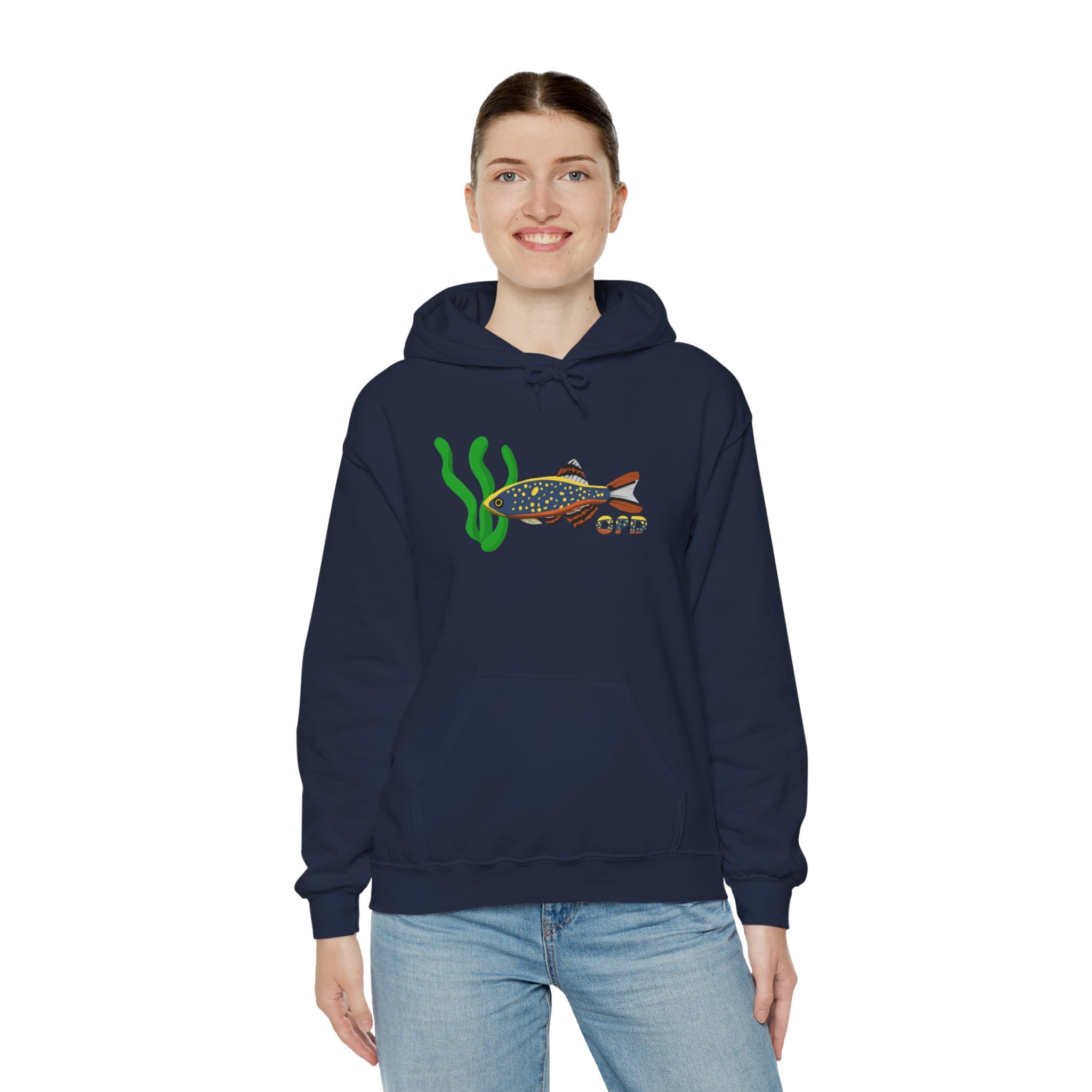 Woman in blue hoodie with Celestial Pearl Danio fish graphic, arms at sides