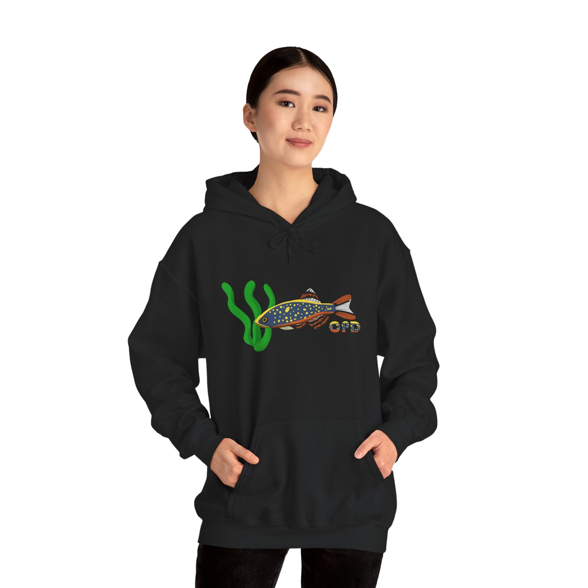 Black Celestial Pearl Danio hoodie with colorful fish and seaweed design worn by a woman