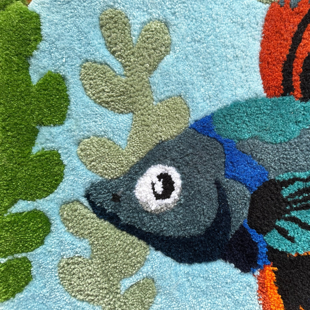 Close-up of Scallywag's Fish Bowl colorful fish rug with detailed blue and green aquatic design
