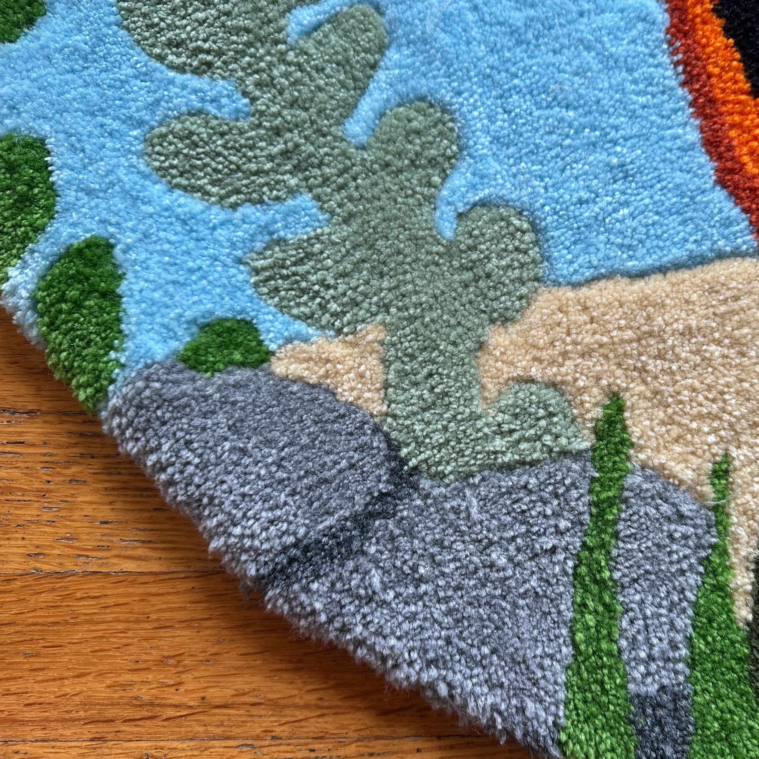 Close-up of Scallywag's Fish Bowl handmade betta fish rug showing colorful underwater plant design and plush texture