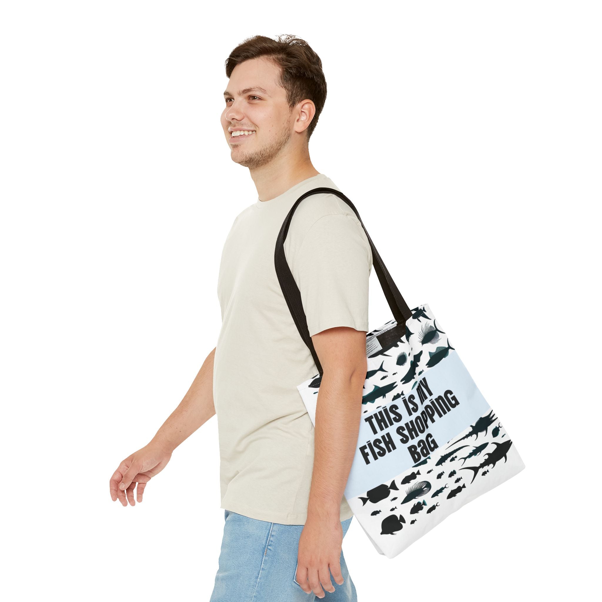 Man carrying a tote bag with fish design and text on a white background