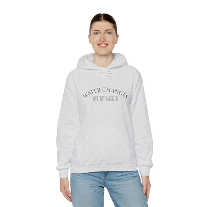 Woman wearing a gray funny fishkeeping hoodie with Water Changes Are My Cardio text