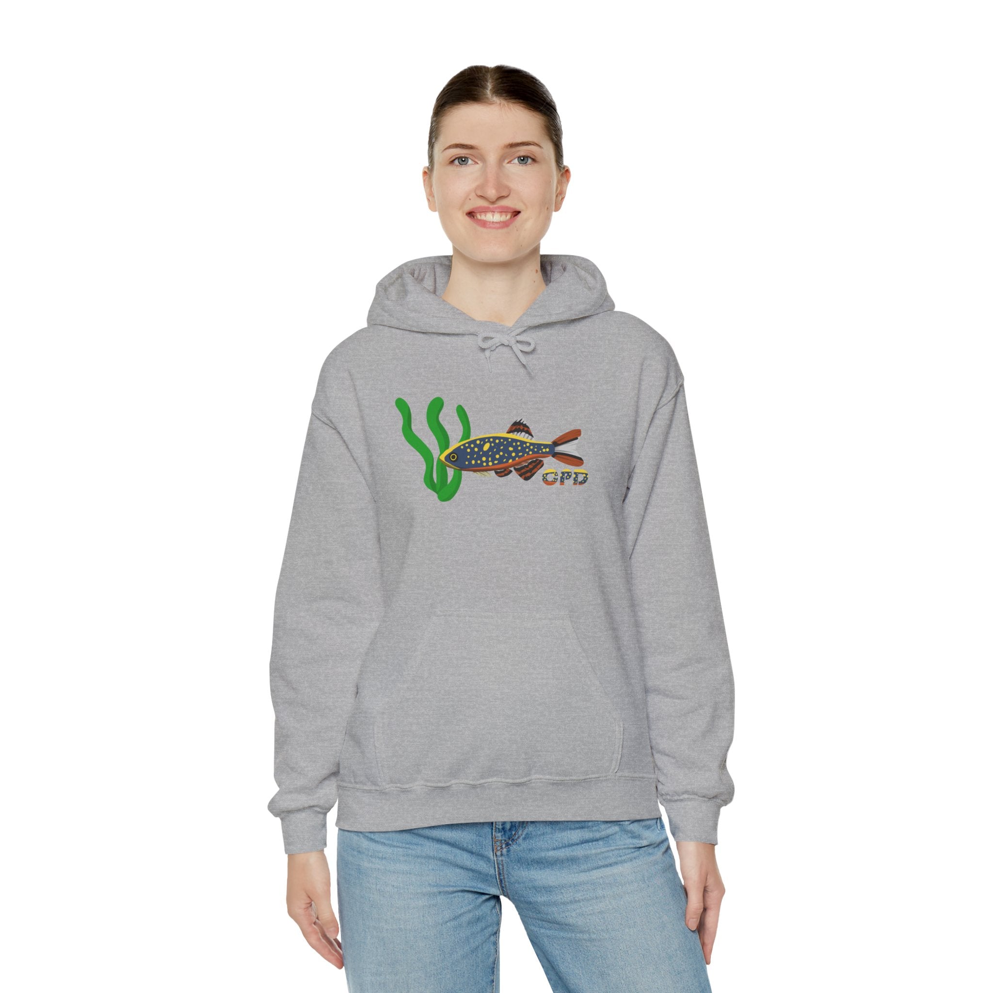 Woman wearing grey hoodie with Galaxy Rasbora fish and plant graphic, hands at sides