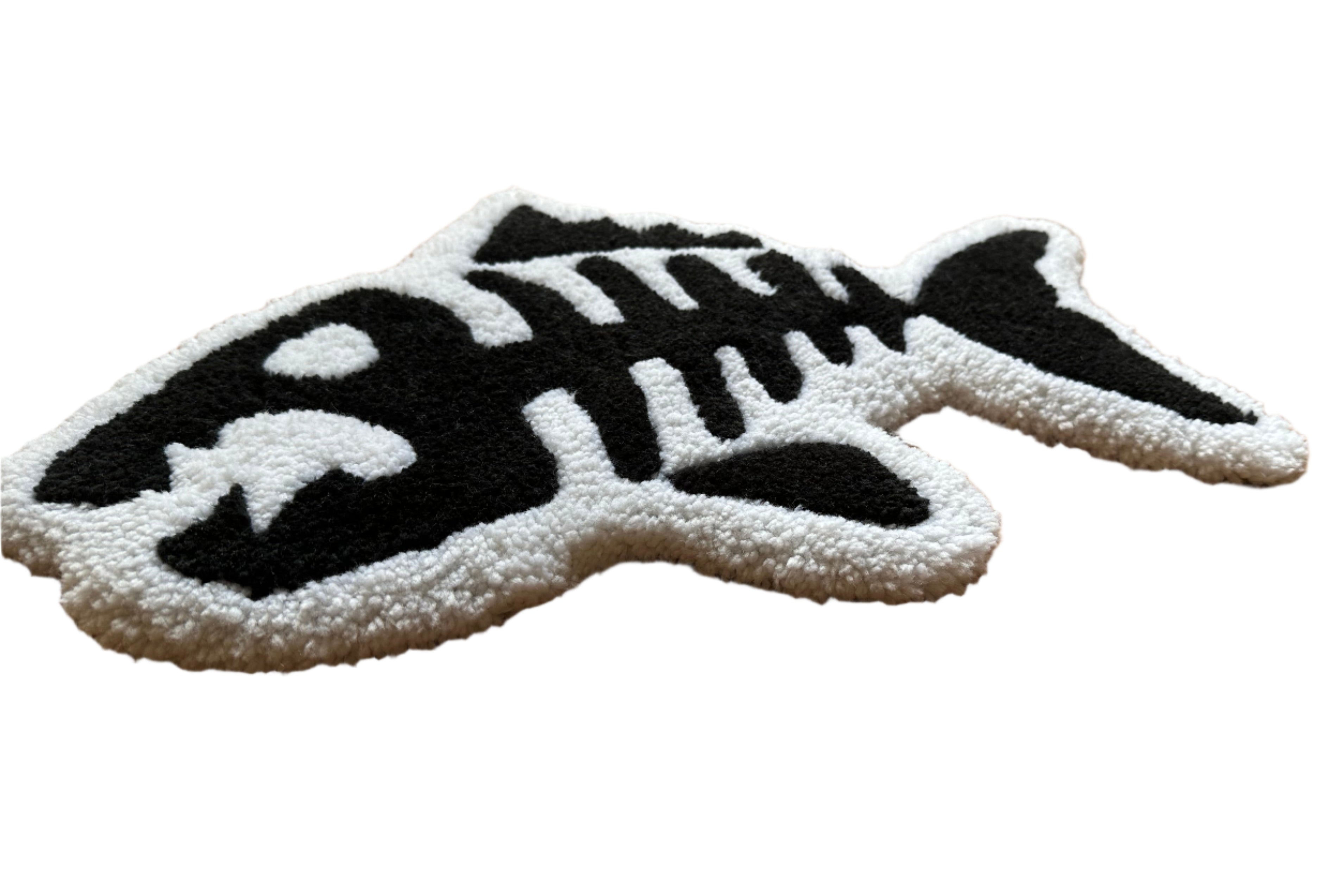 Scallywags Fish Bowl handmade fish bones rug shaped like a black and white fish skeleton