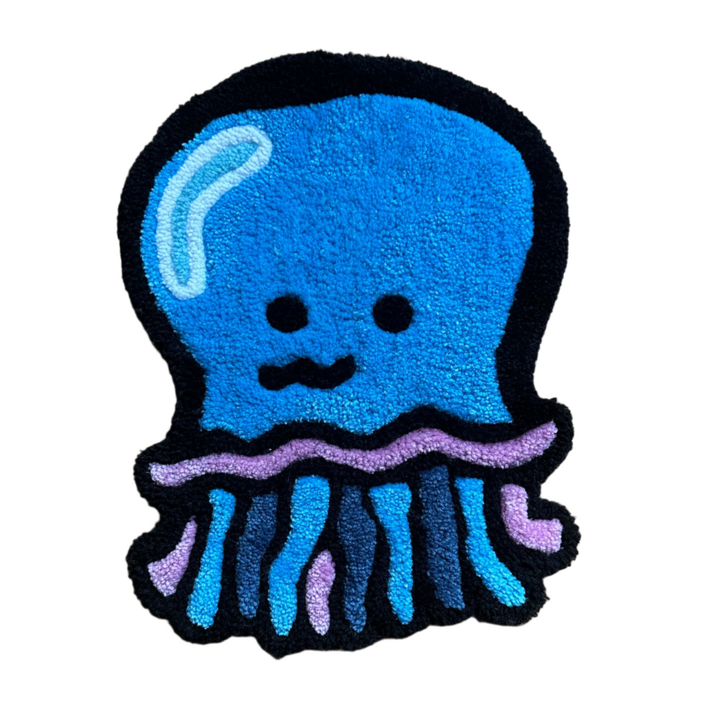 Scallywag's Fish Bowl handmade jellyfish rug in blue black and purple with cute face design