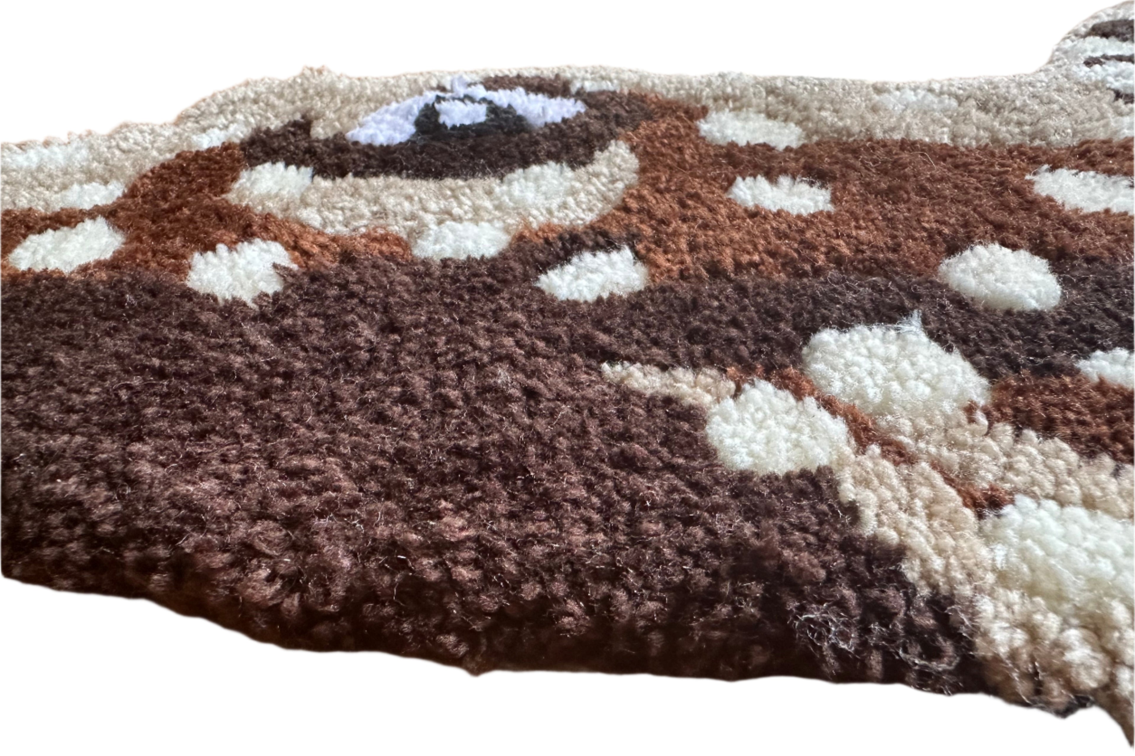 Close-up view of handmade pleco rug with brown and white textured fibers by Scallywag's Fish Bowl