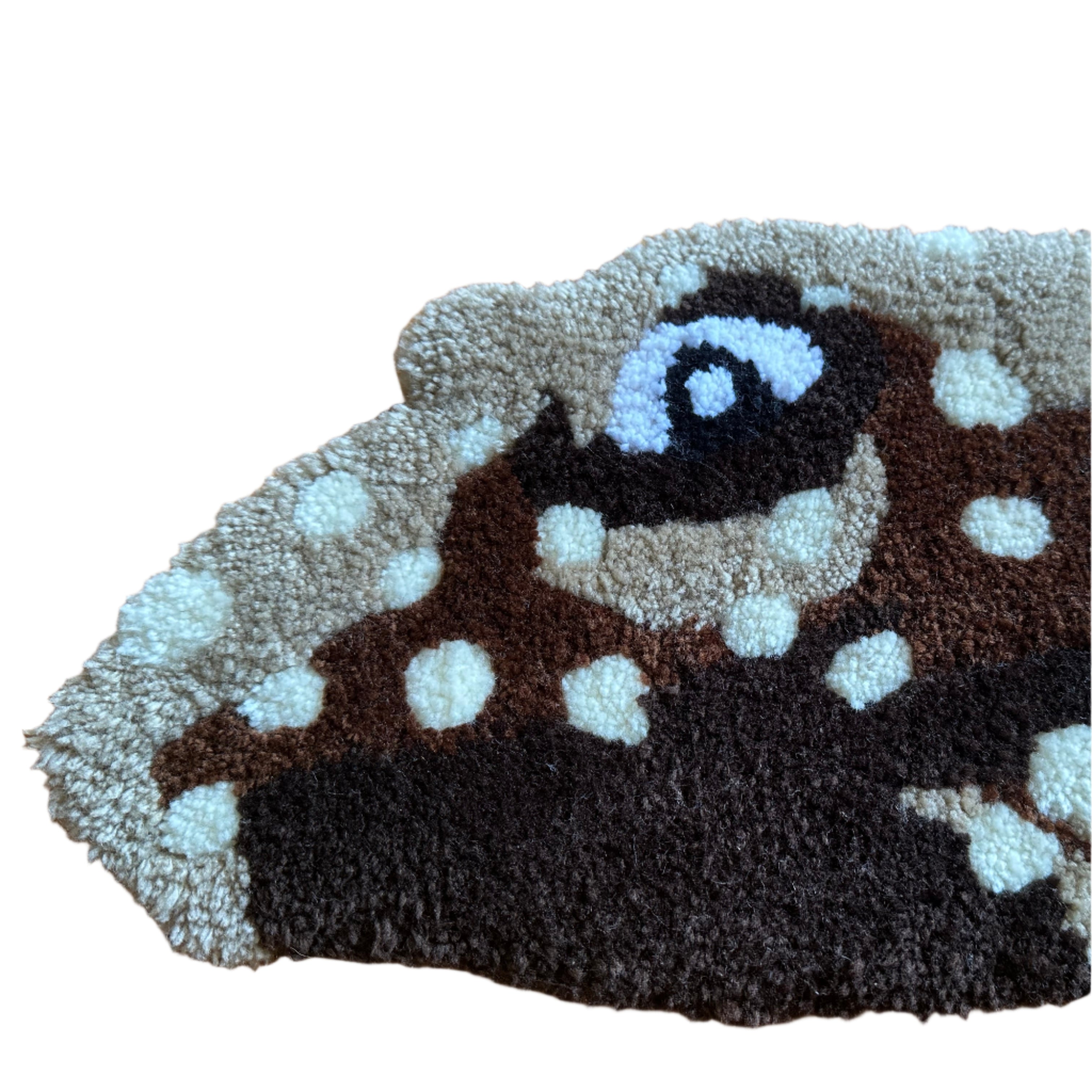 Handmade pleco rug by Scallywag's Fish Bowl with textured brown and white spotted design