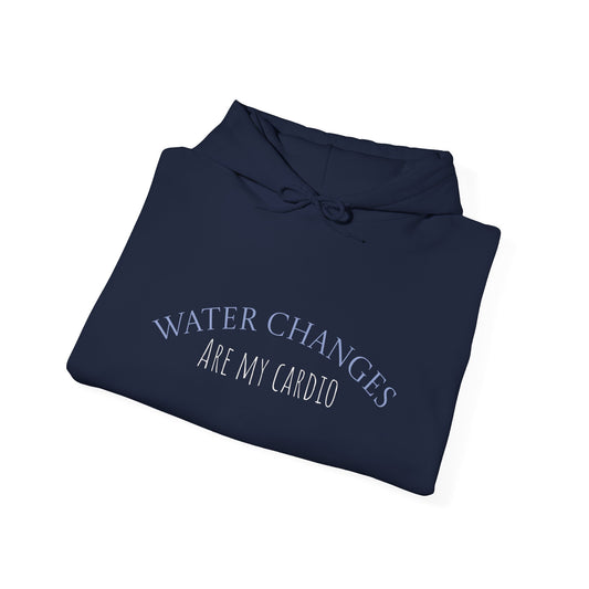 Folded navy hoodie laid flat showing “Water Changes Are My Cardio” graphic on chest