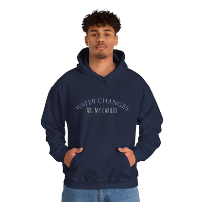 Man wearing navy “Water Changes Are My Cardio” hoodie with hands in front pocket