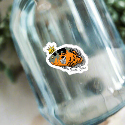 Oscar Cichlid vinyl sticker with colorful fish design and crown on glass surface