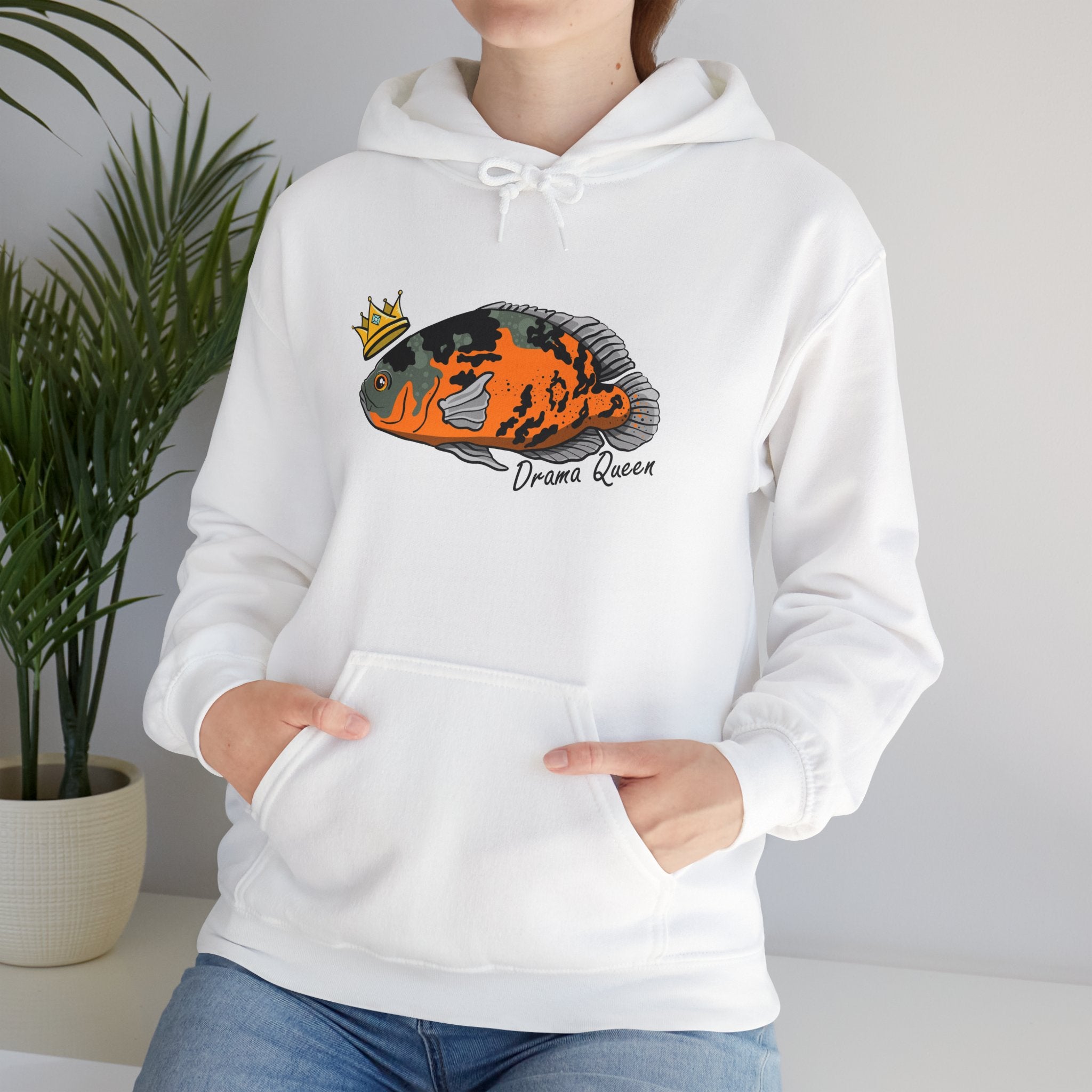 White Oscar fish hoodie with colorful fish graphic and drama queen text worn by person