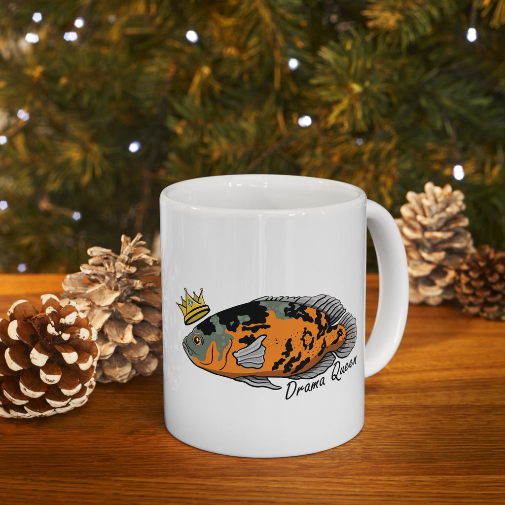White mug featuring a colorful Oscar fish illustration with a crown and Drama Queen text Oscar fish mug gift