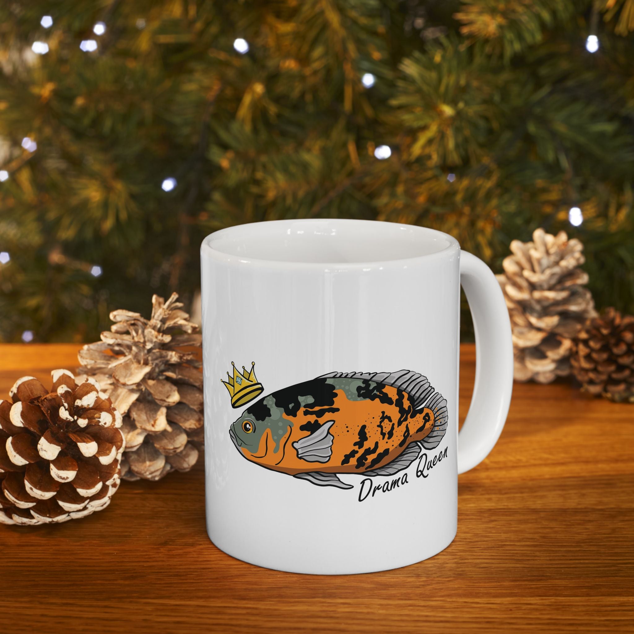 White mug featuring a colorful Oscar fish illustration with a crown and Drama Queen text Oscar fish mug gift