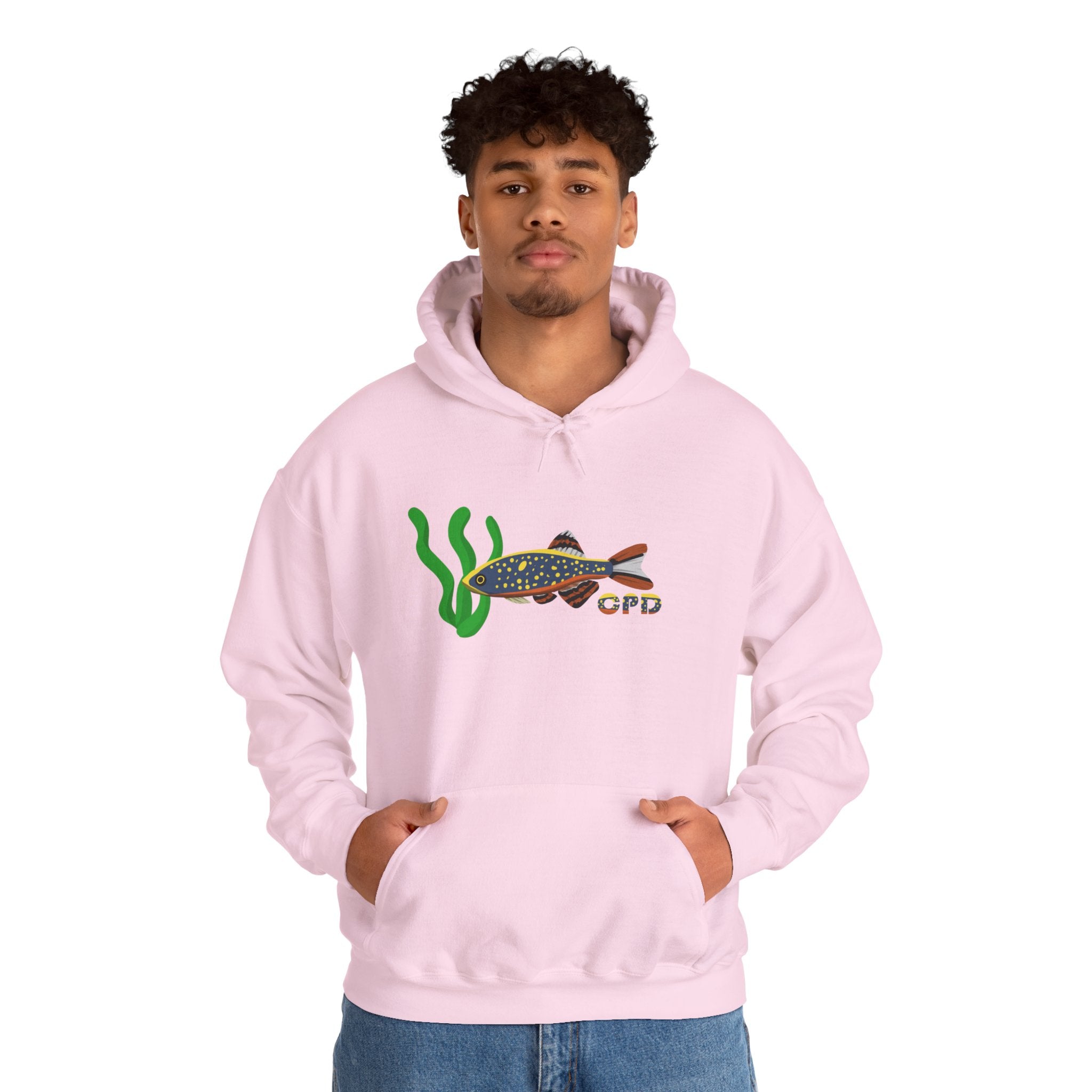 Man wearing pink hoodie with Galaxy Rasbora design, hands in pocket