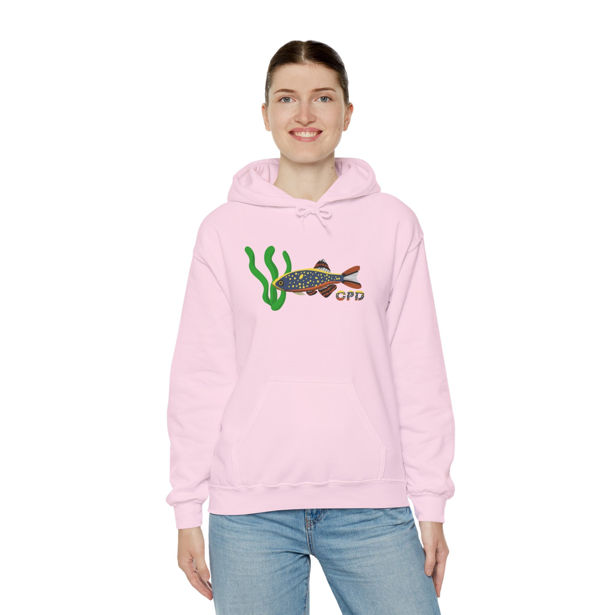Woman wearing pink hoodie with Galaxy Rasbora fish and plant graphic, arms at sides