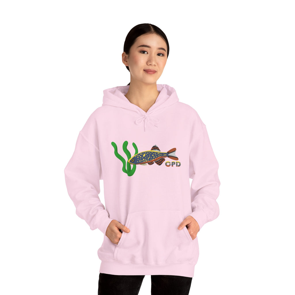 Woman in oversized pink hoodie with Galaxy Rasbora fish chest print