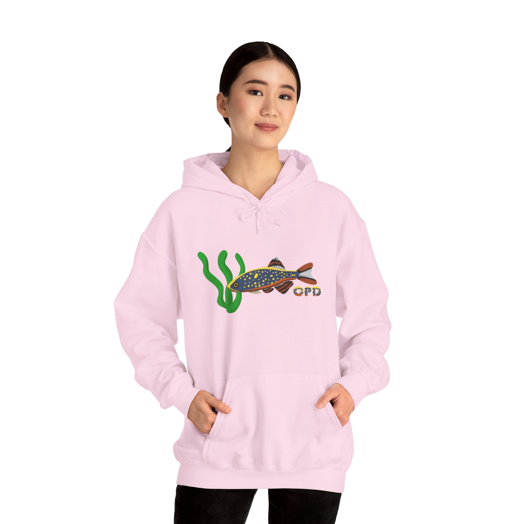 Woman in oversized pink hoodie with Galaxy Rasbora fish chest print