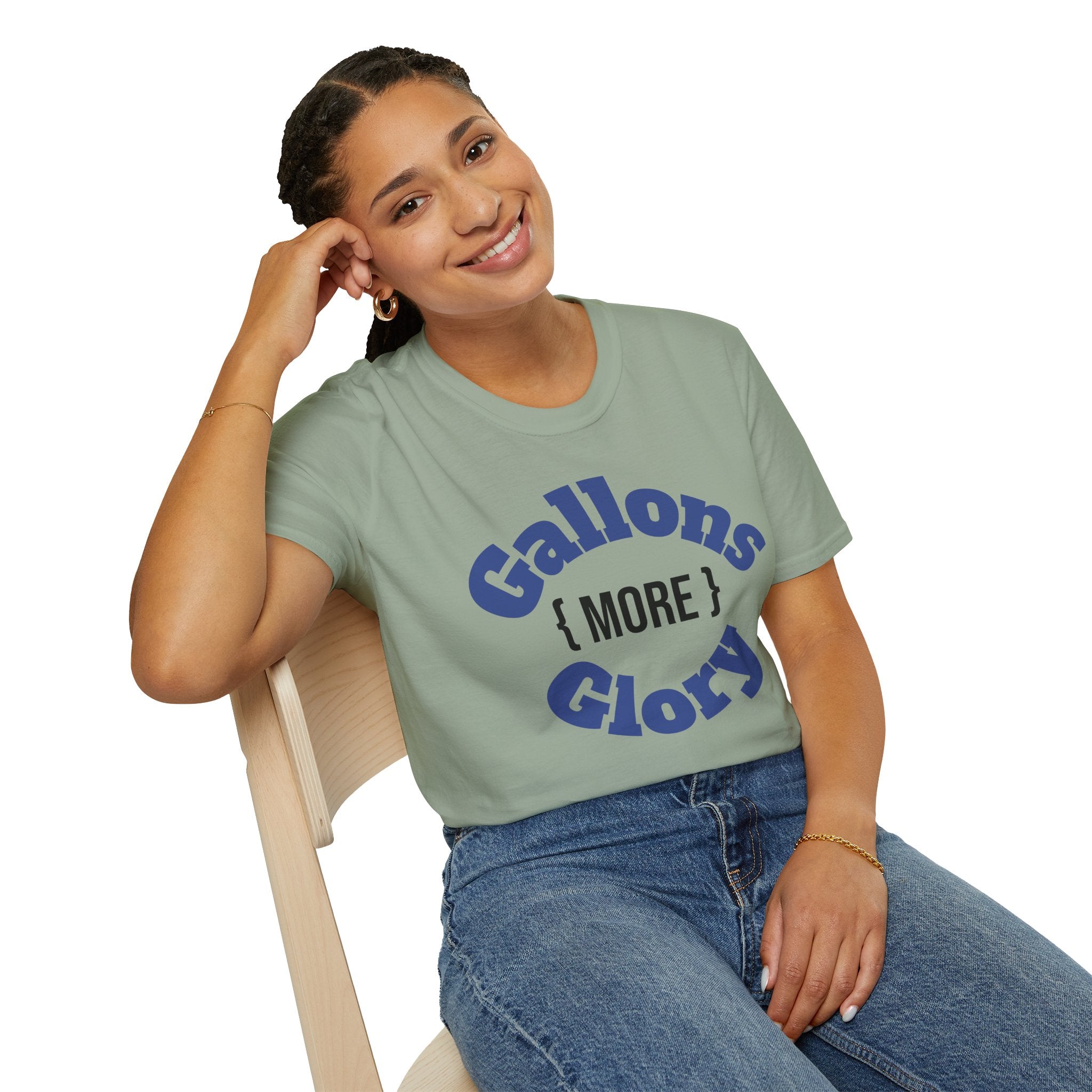 Monster tank hobbyist t-shirt in sage green with Gallons More Glory graphic worn by smiling woman
