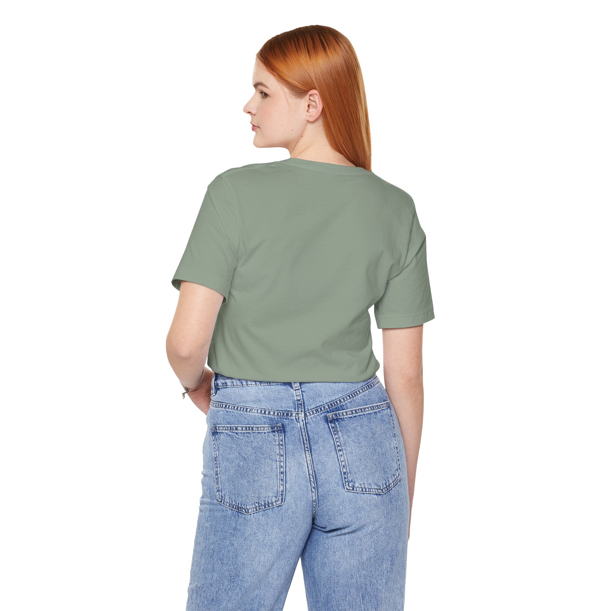 Back view of woman wearing green Drama Queen Oscar Fish T-Shirt with blue jeans