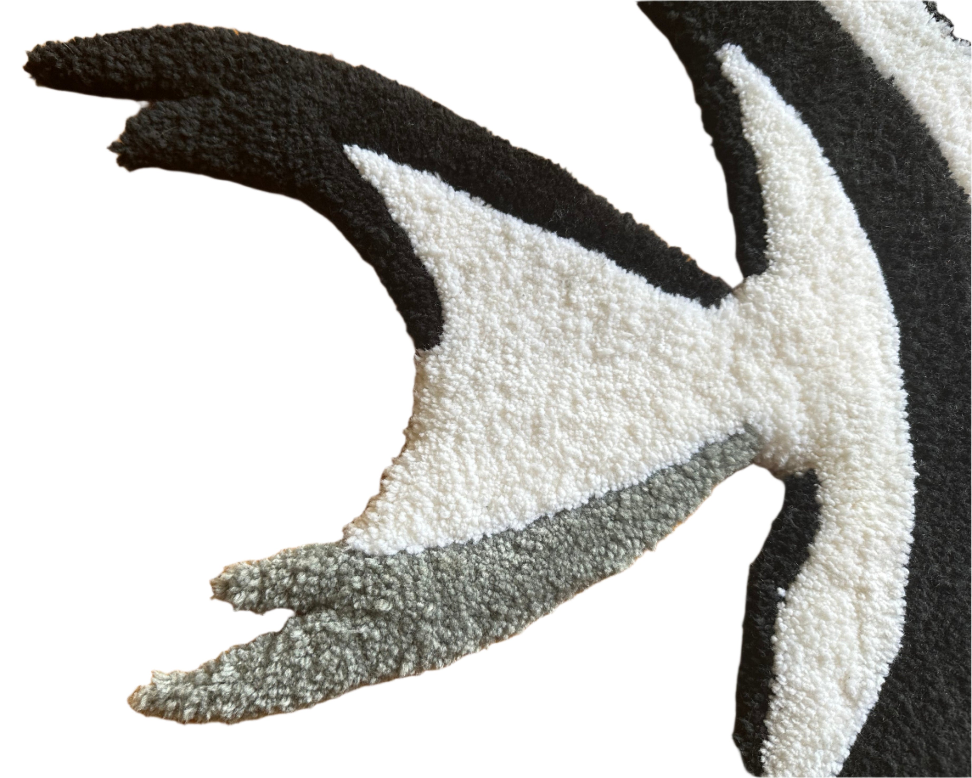 Close-up of Scallywag's Fish Bowl black white and gray Fish Rug tail with textured fibers